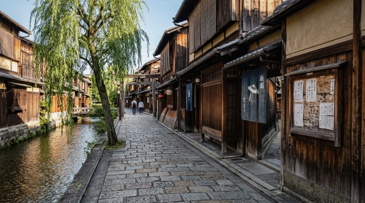 A quiet Hanamikoji-dori street in Gion at dusk with lanterns and machiya facades, illustrating where Gion photography rules allow a camera on public ground